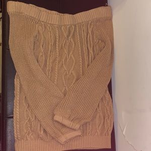 an off shoulder tan sweater
